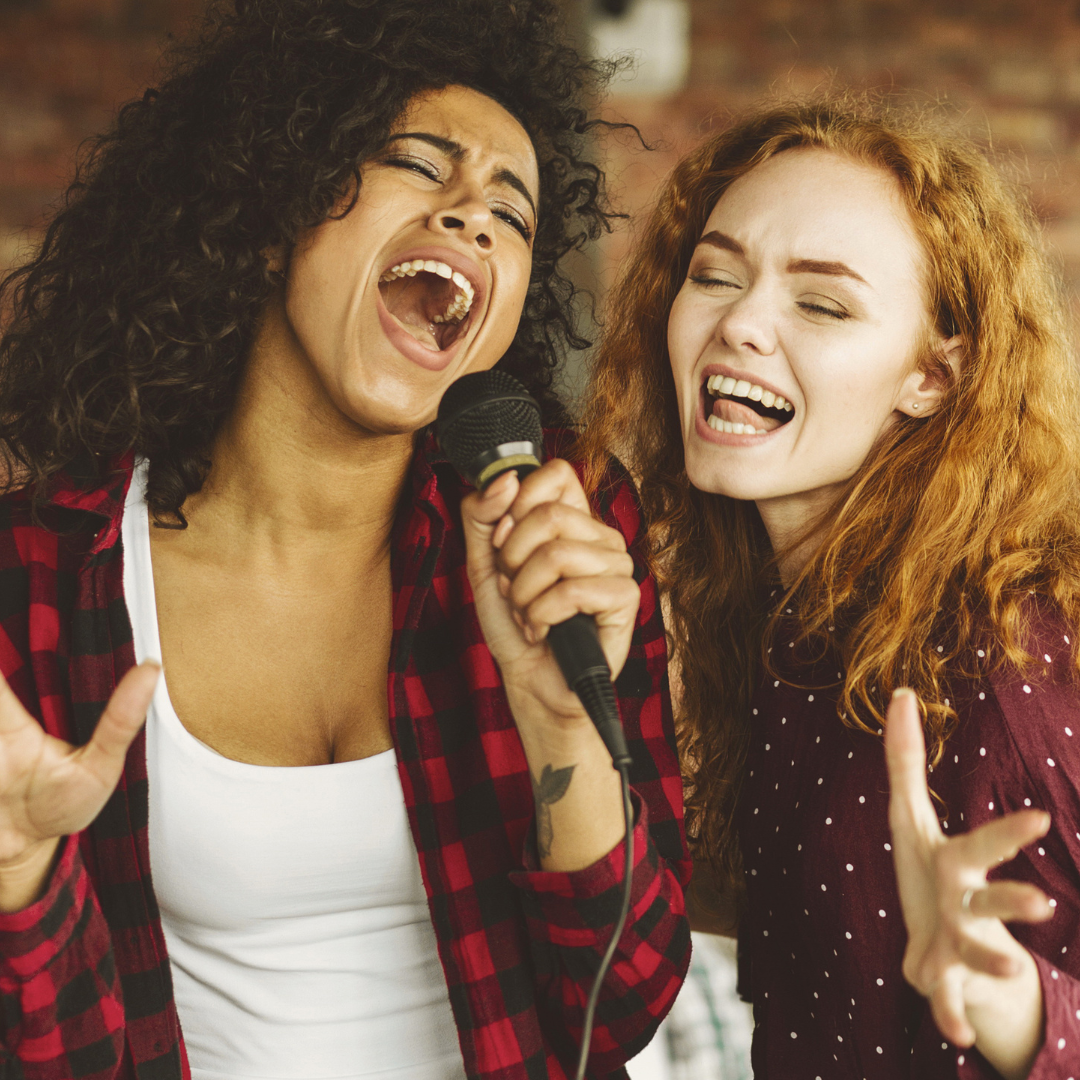 two girls singing